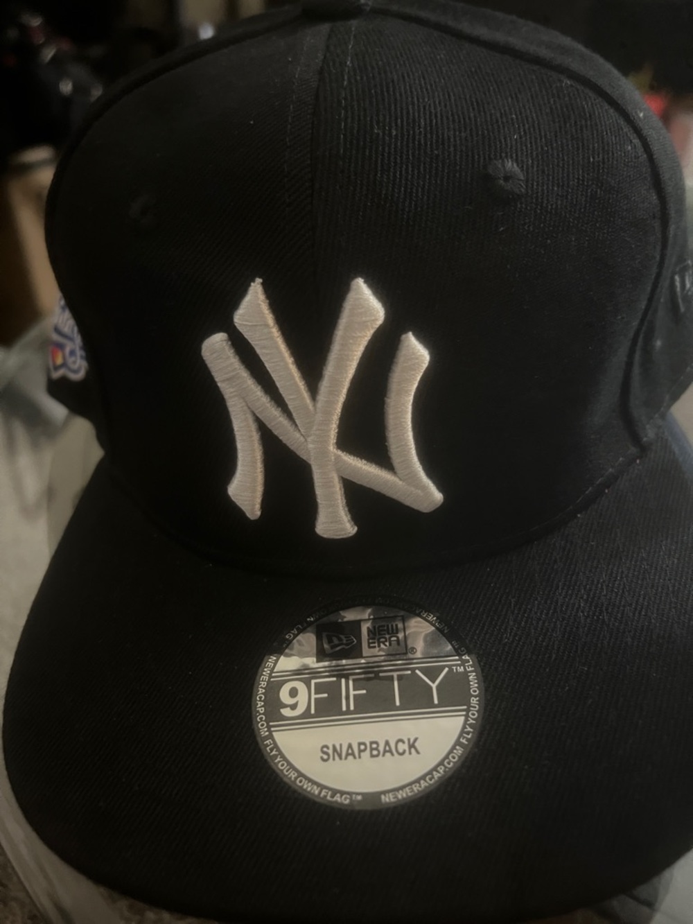 New Era Black Snapback Hat with White NY Logo